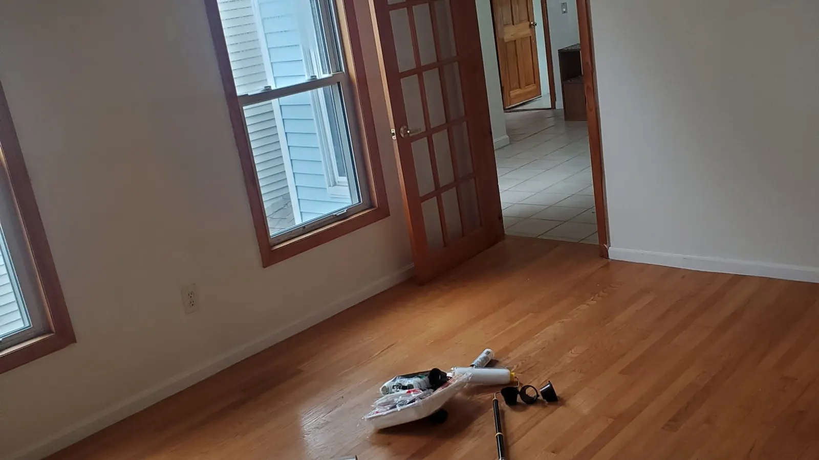 Hardwood flooring installation in Lynn, MA in a room with a tall window